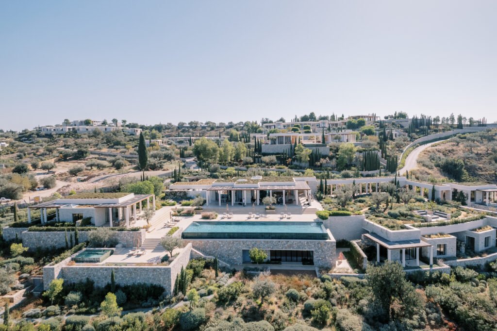 Hotel complex Amanzoe with terraces and swimming pools in the mountains. Peloponnese, Greece. Drone
