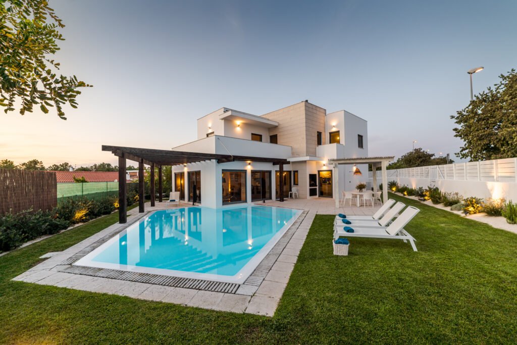 Modern house with garden swimming pool and wooden pergula
